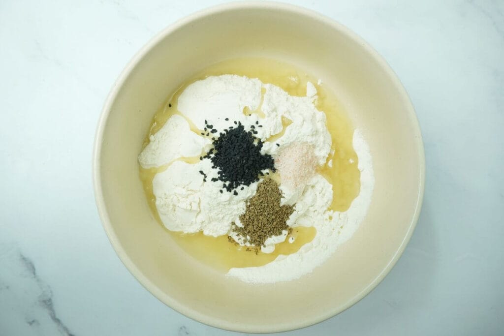 air fryer namak pare nimki put all spices in mixing bowl
